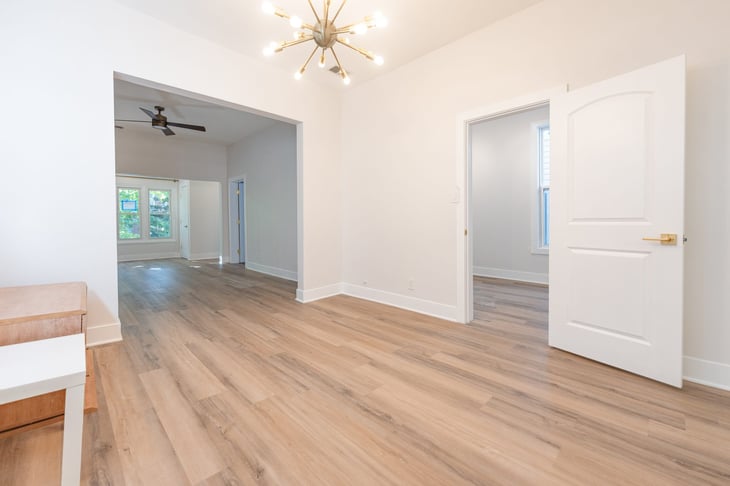 Living and dining room at a Quality Builders two-flat project in Hermosa